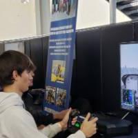 Student at Flight Simulator at Exhibition Hall